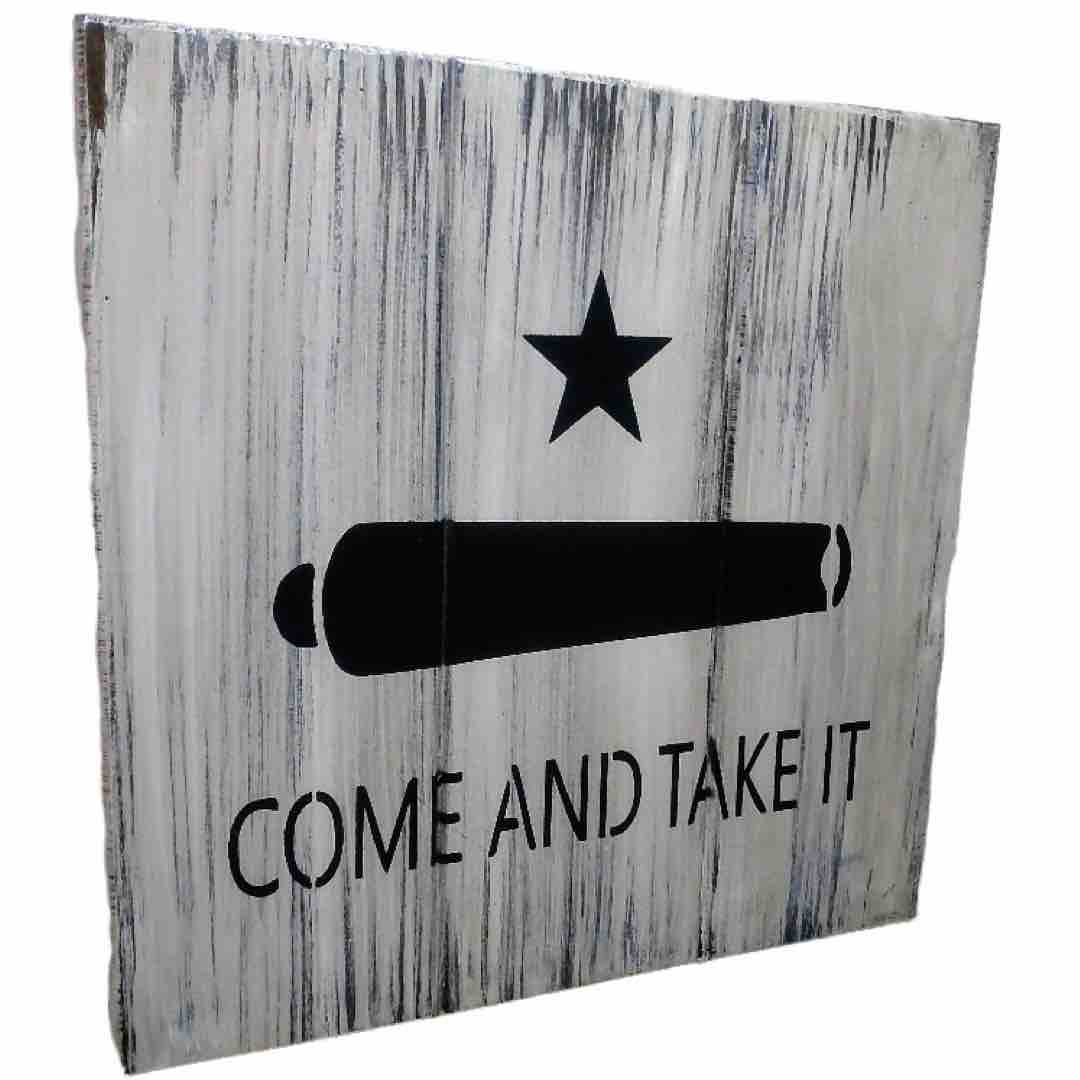 Angled view of Come and Take It gun concealment wall art box