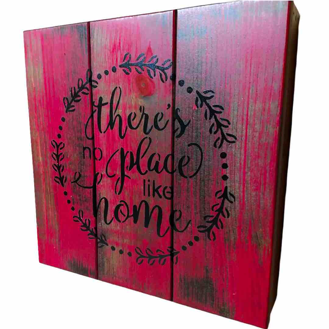 angled view of "There's No Place Like Home" concealment wall art box
